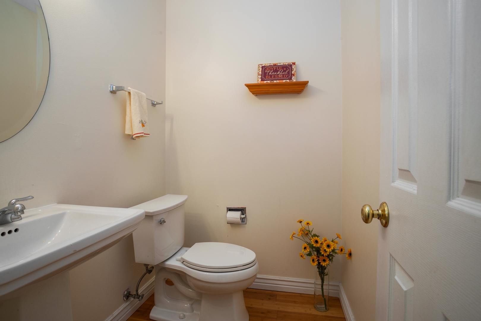 153 Inverness Court Elk Grove Village, IL 60007 - Photo 14 of 16 a bathroom with a toilet sink and mirror