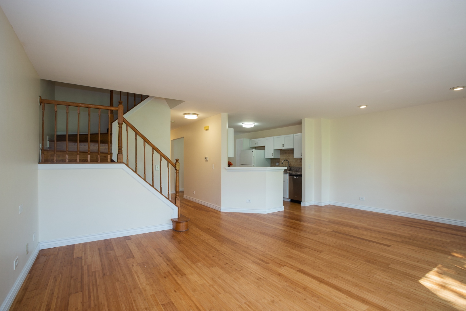 153 Inverness Court Elk Grove Village, IL 60007 - Photo 3 of 16 a view of a kitchen with wooden floor and staircase