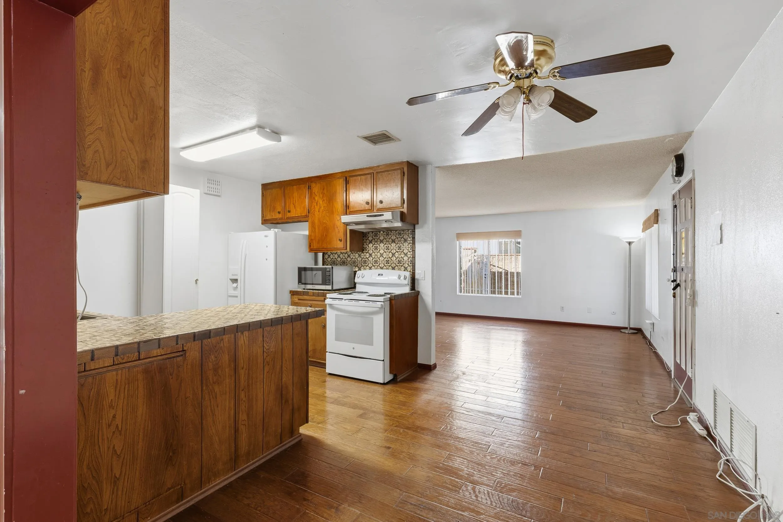 538 Paraiso Avenue Spring Valley, CA 91977 - Photo 5 of 17 a view of a kitchen with a sink and a window