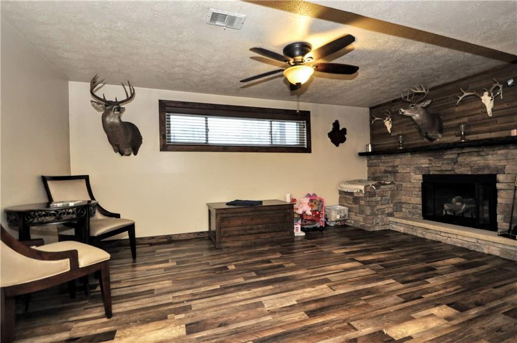 63 Blair Road Eighty Four, PA 15330 - Photo 24 of 36 a living room with furniture and a fireplace