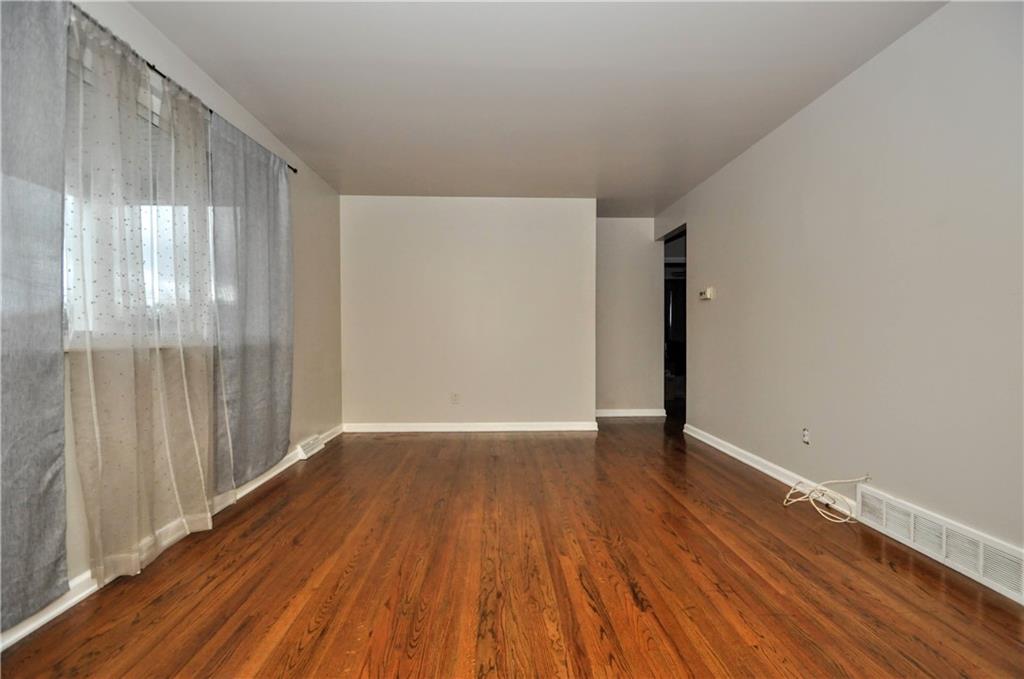 63 Blair Road Eighty Four, PA 15330 - Photo 8 of 36 a view of an empty room with wooden floor and a window