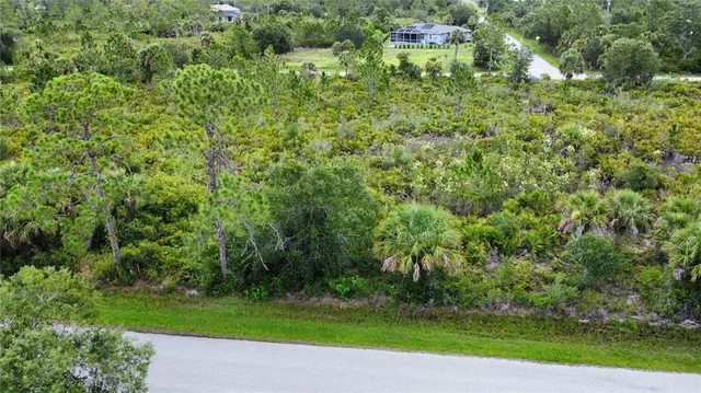 a view of a garden with a building