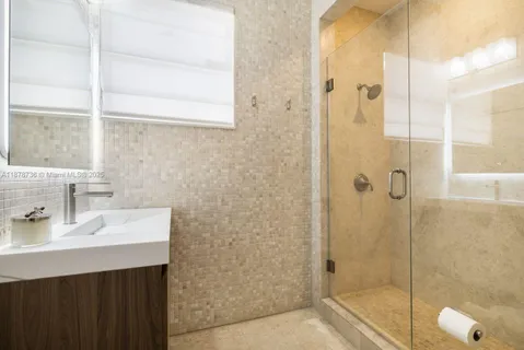 a spacious bedroom with a bed and a window