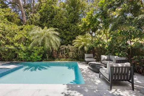 a view of a backyard of the house