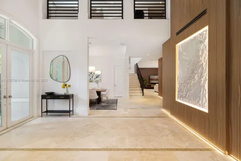 a living room with furniture a window and a fireplace