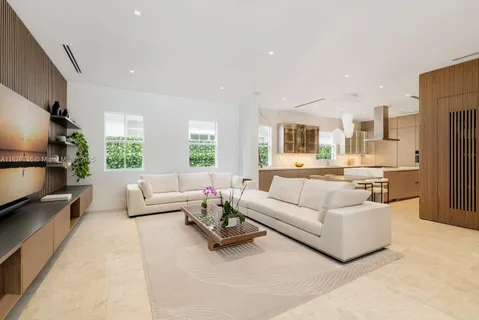 a living room with furniture or couch and a large window