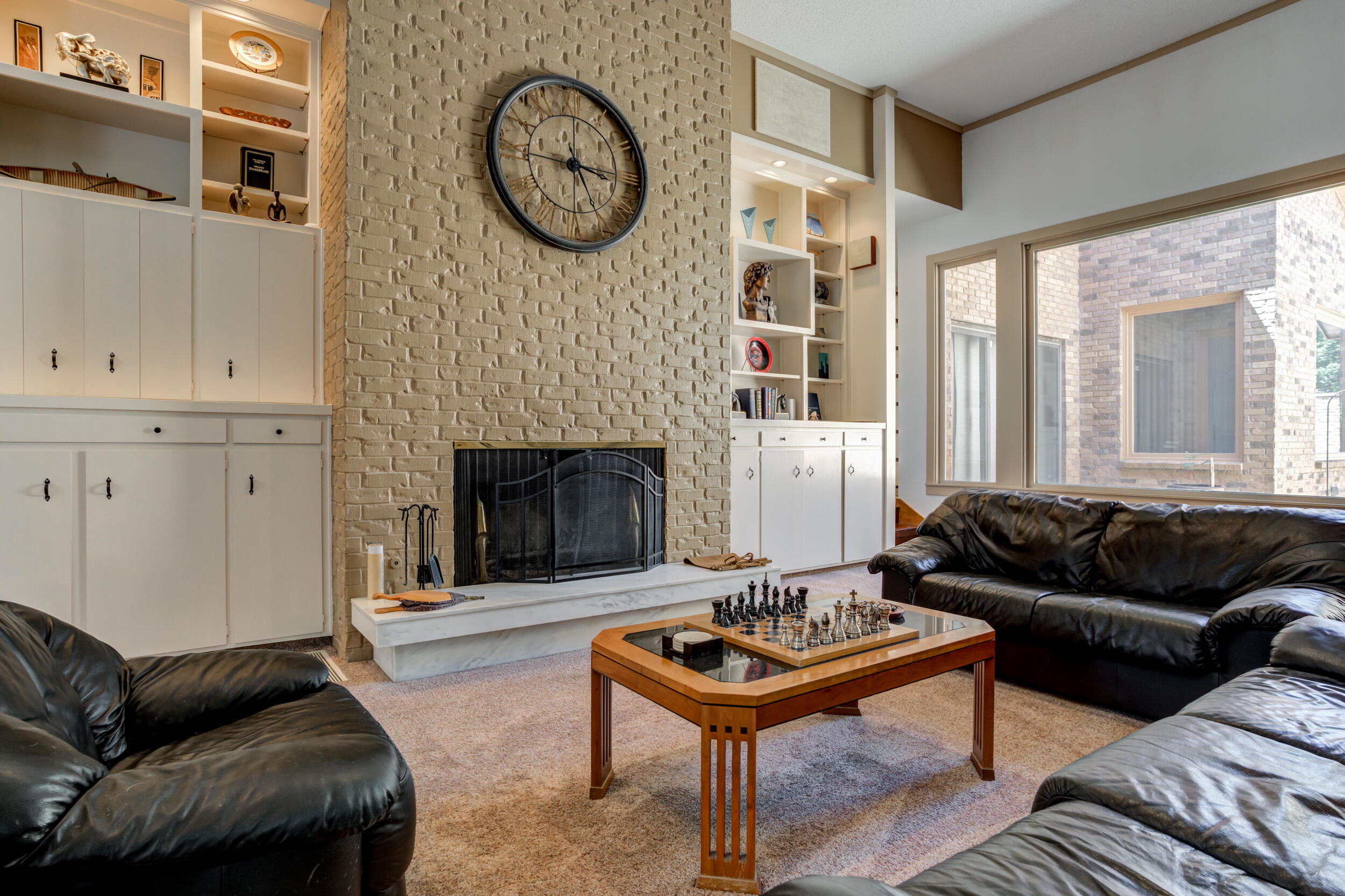 4528 7th Street Lubbock, TX 79416 - Photo 24 of 69 a living room with furniture and a fireplace