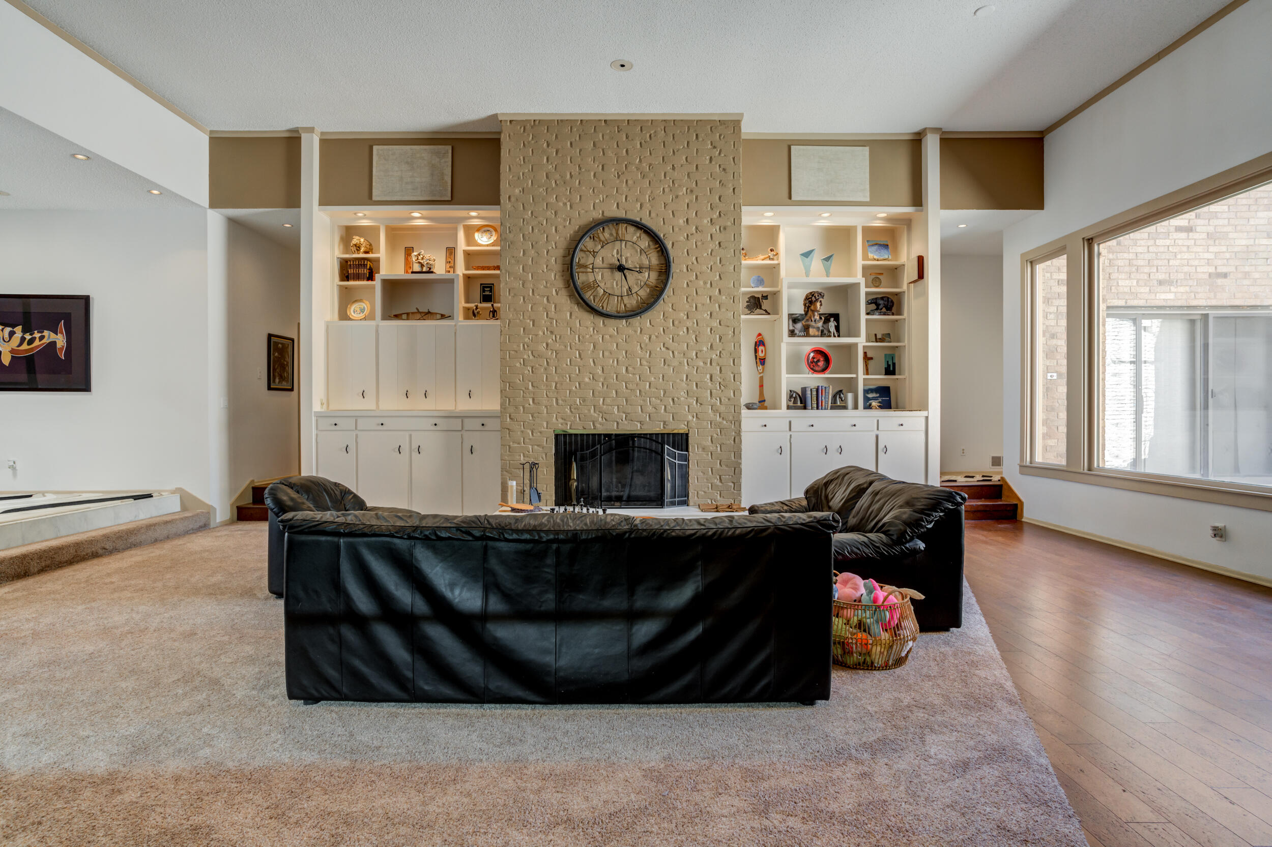 4528 7th Street Lubbock, TX 79416 - Photo 26 of 69 a living room with furniture a fireplace and a large window