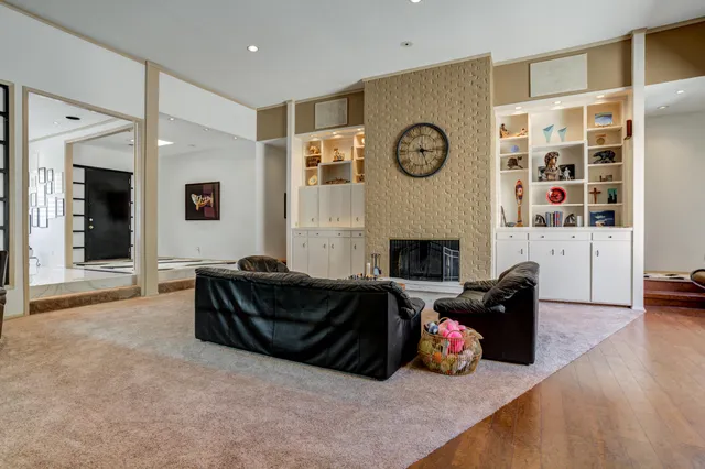 a bedroom with a bed and a book shelf