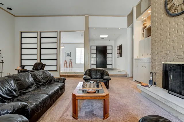 a bathroom with a granite countertop sink mirror and shower