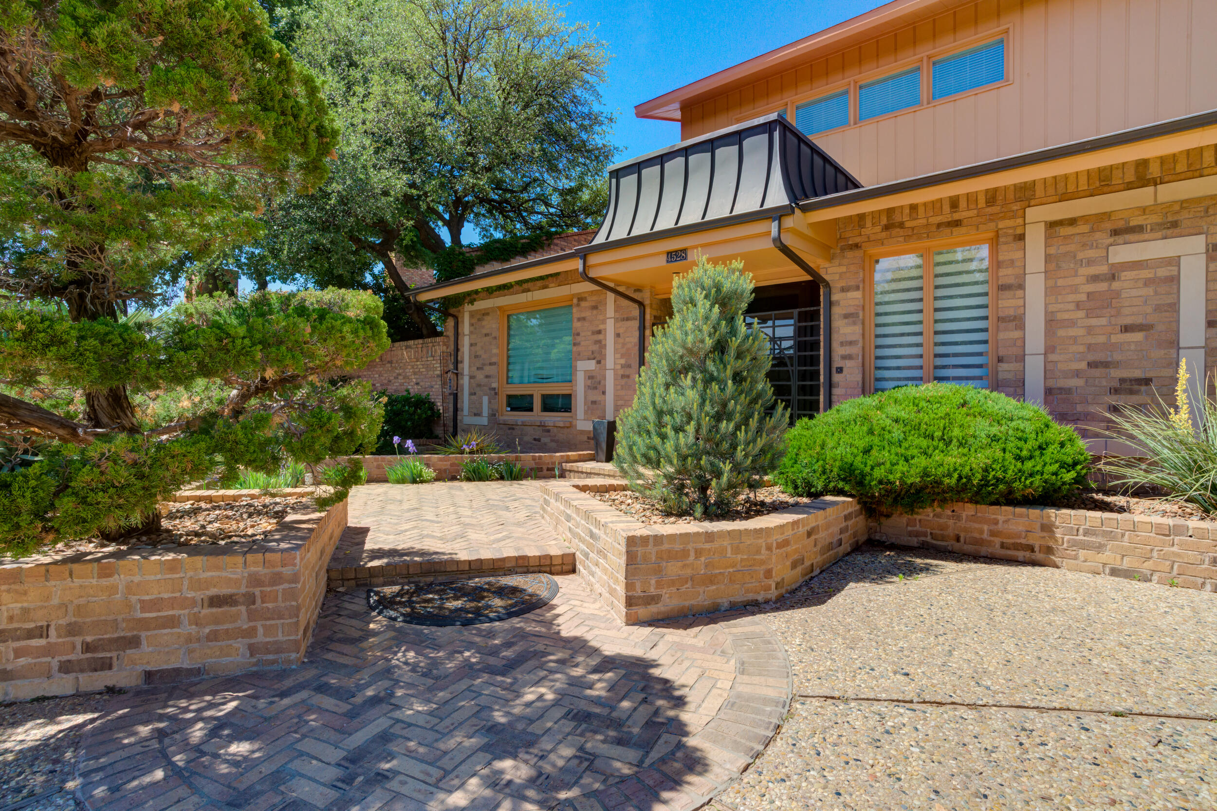 4528 7th Street Lubbock, TX 79416 - Photo 3 of 69 a view of a house with backyard and sitting area