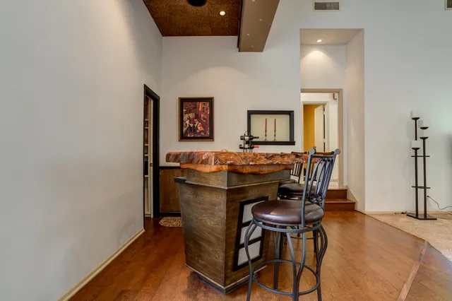 a bed room with a bed and a chair