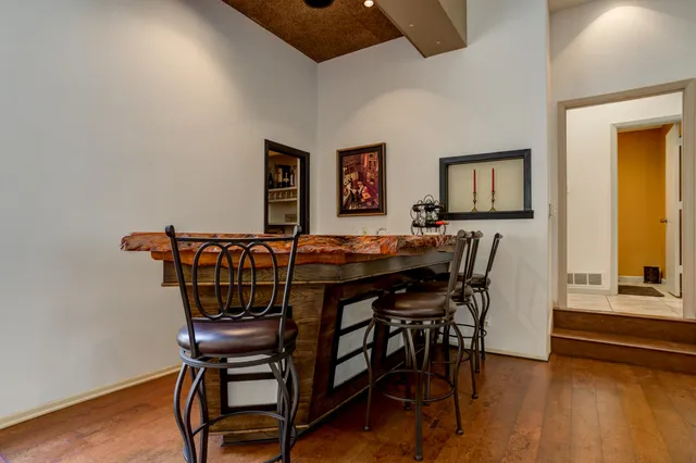 a bedroom with a bed gym equipment and a window