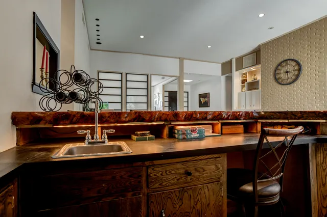a bathroom with a bathtub sink a mirror and shower