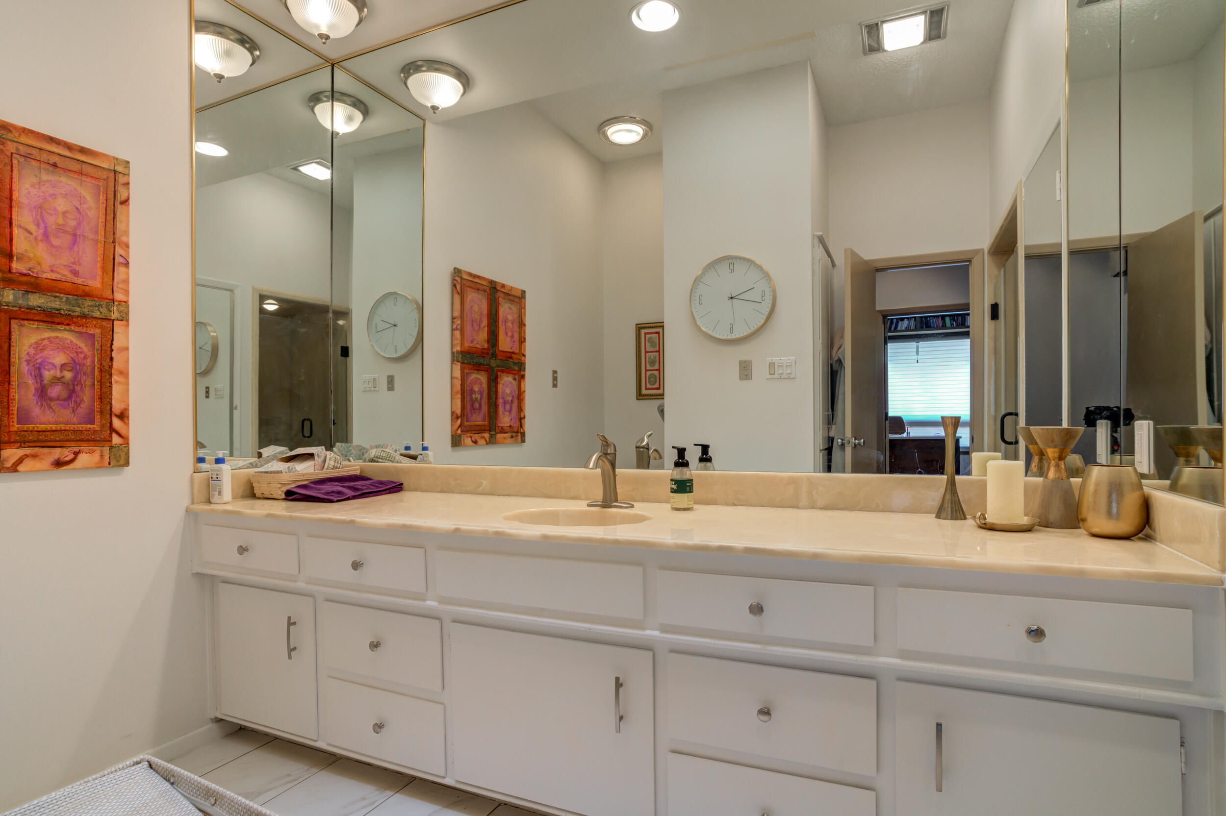 4528 7th Street Lubbock, TX 79416 - Photo 37 of 69 a bathroom with a sink and a mirror