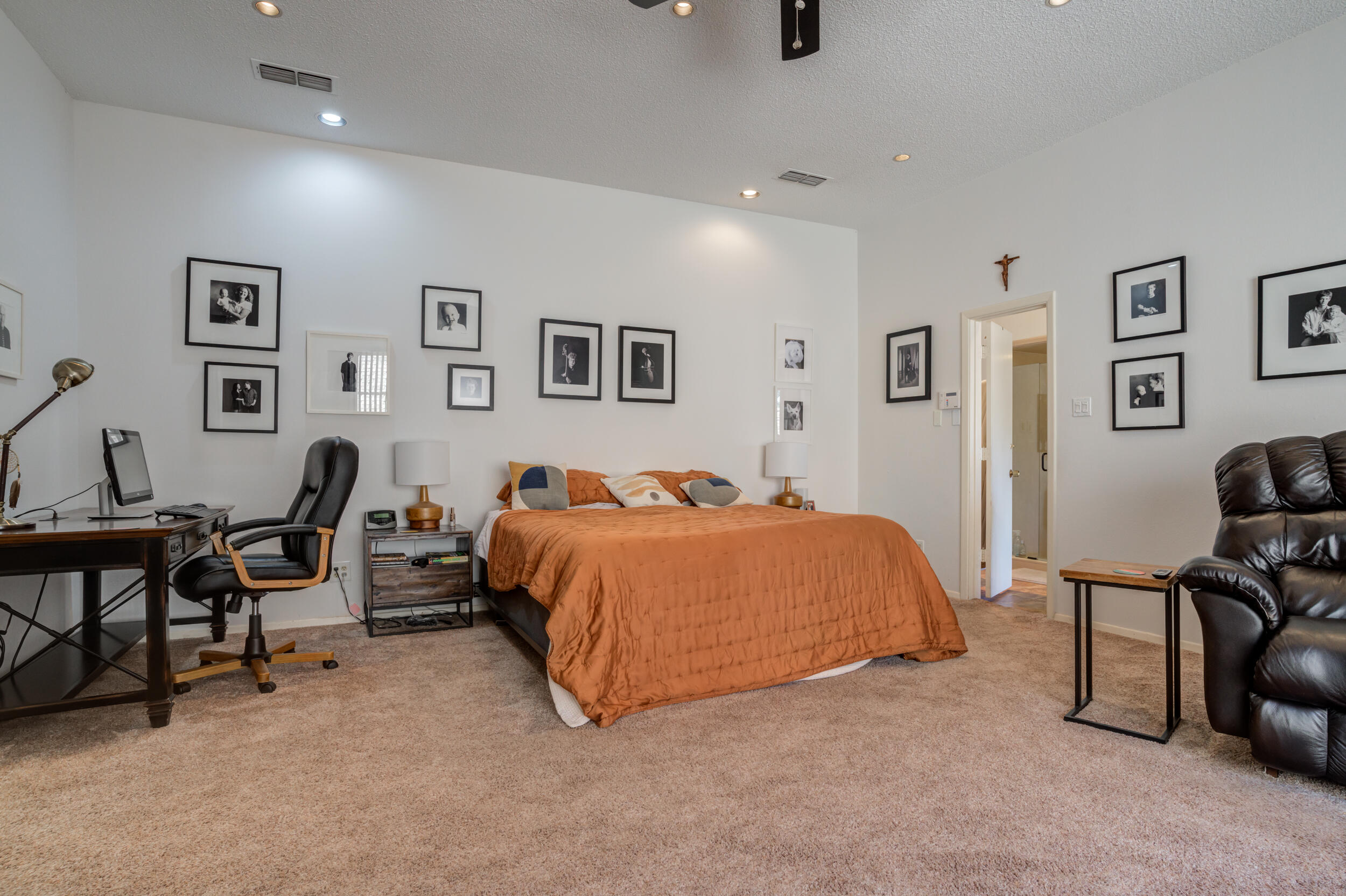 4528 7th Street Lubbock, TX 79416 - Photo 40 of 69 a bed room with a bed and a chair