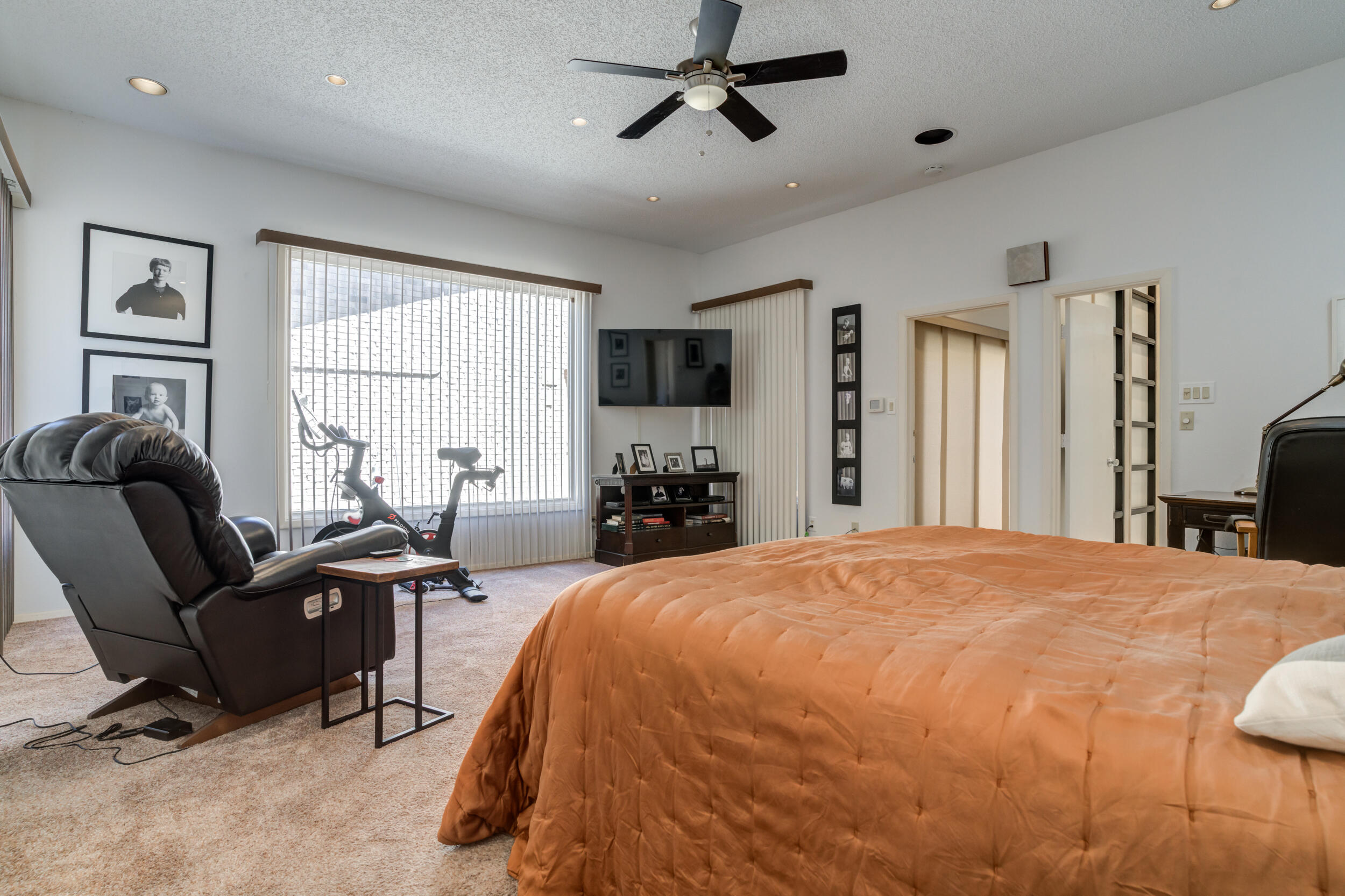 4528 7th Street Lubbock, TX 79416 - Photo 41 of 69 a bedroom with a bed gym equipment and a window