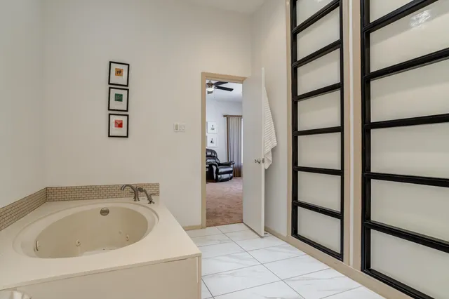 a utility room with cabinets washer and dryer