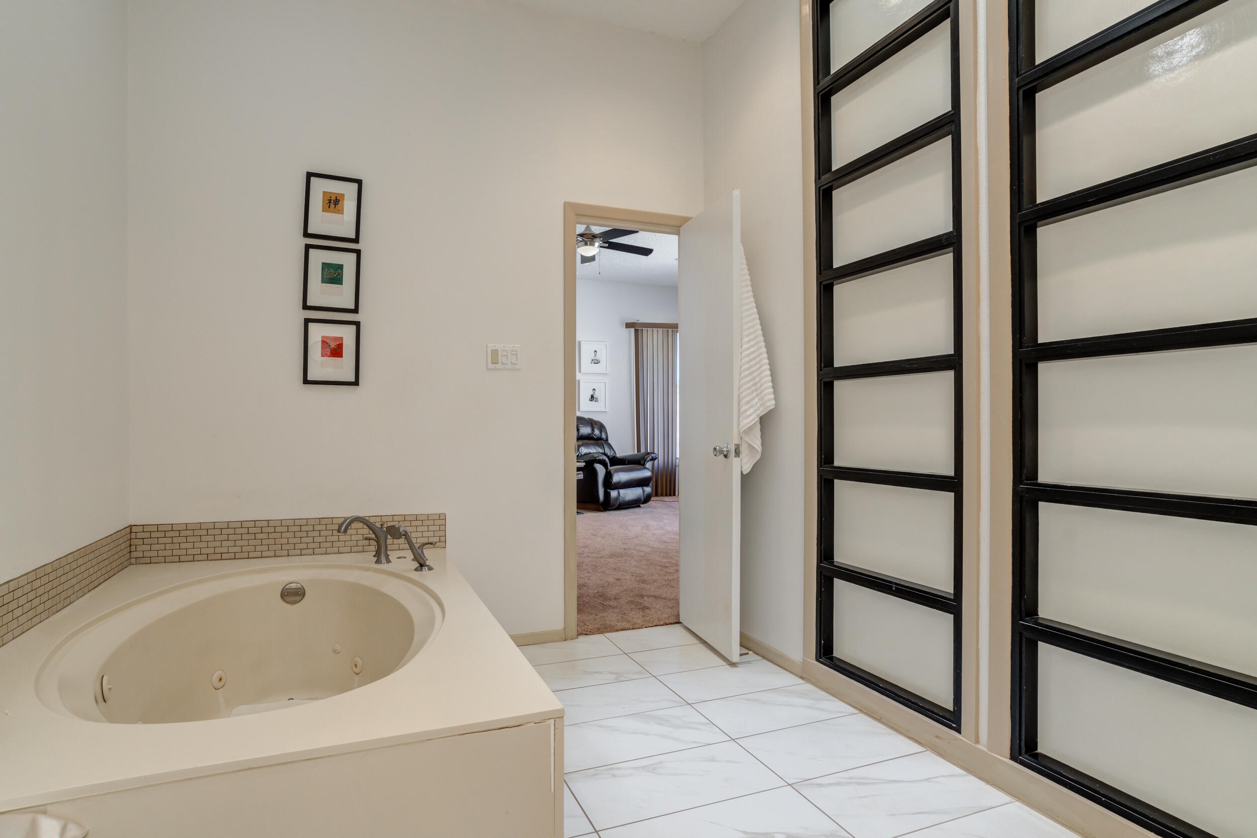4528 7th Street Lubbock, TX 79416 - Photo 44 of 69 a bathroom with a sink and a tub