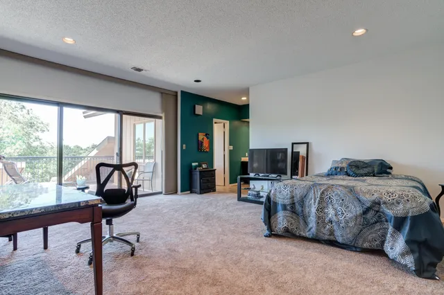 a view of a brick house with a large windows
