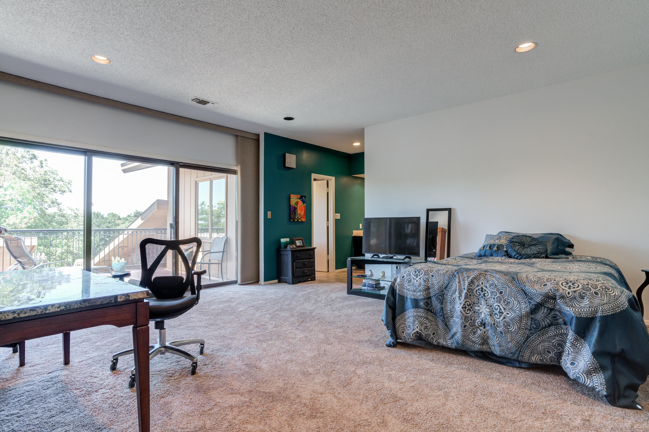 4528 7th Street Lubbock, TX 79416 - Photo 49 of 69 a living room with a bed furniture and a large window
