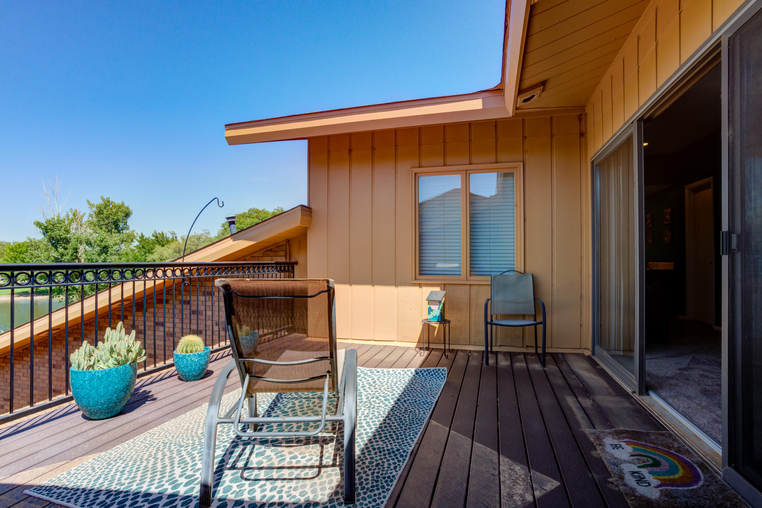 4528 7th Street Lubbock, TX 79416 - Photo 58 of 69 a view of balcony with two chairs and wooden floor