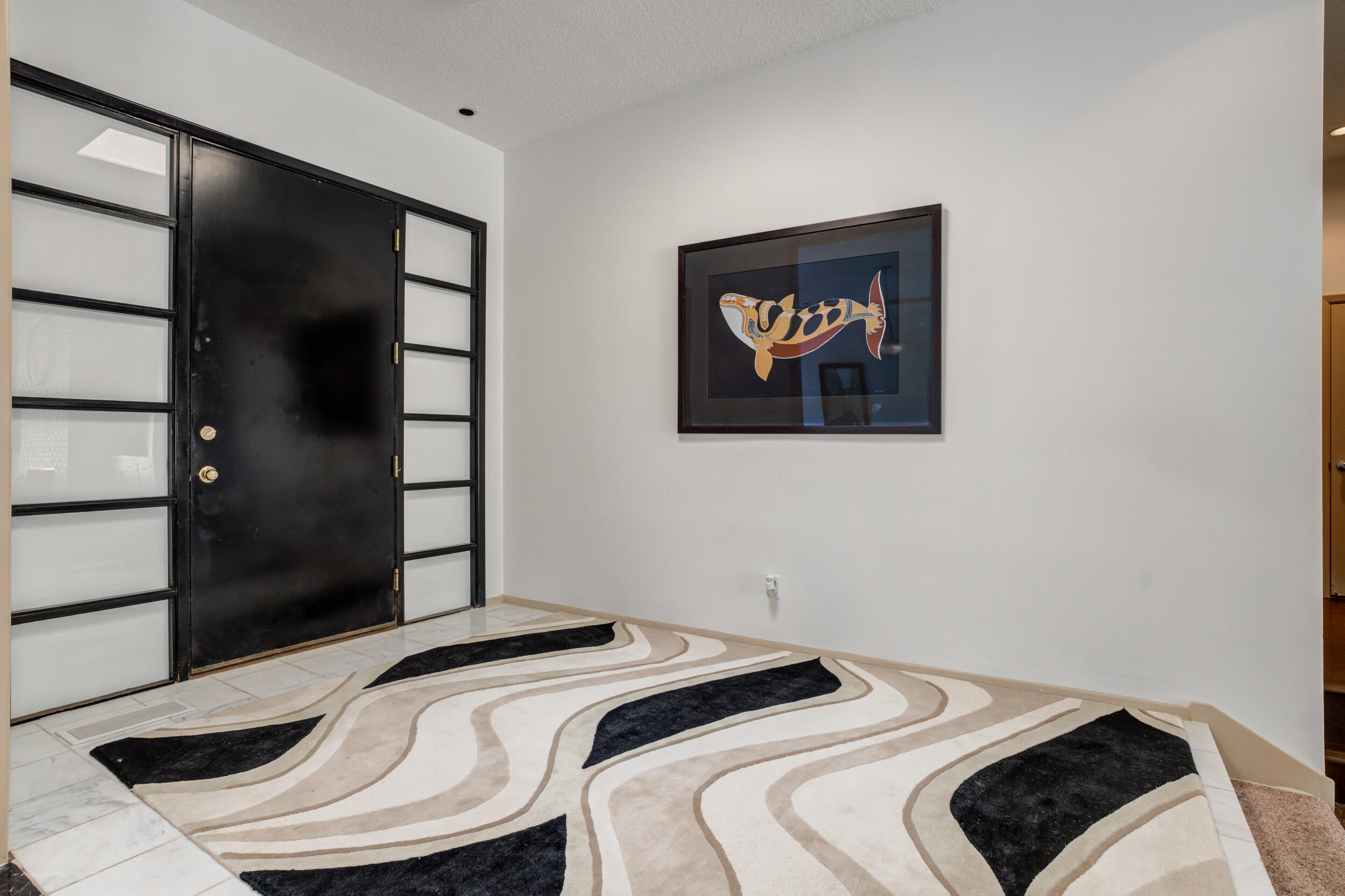 4528 7th Street Lubbock, TX 79416 - Photo 6 of 69 a bedroom with a bed and a painting on the wall