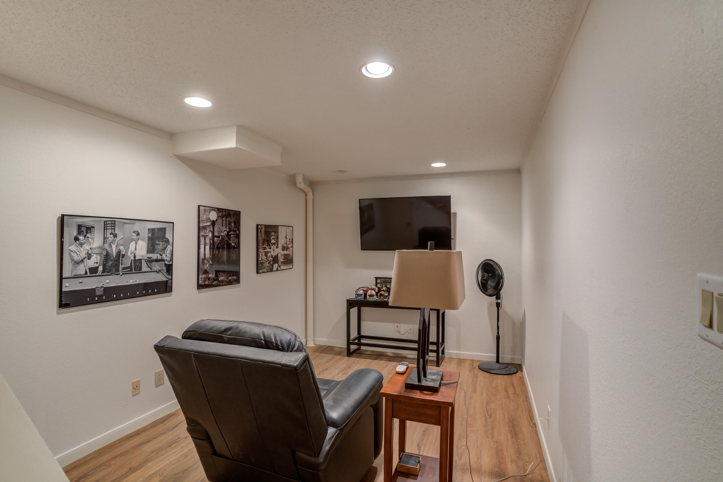 4528 7th Street Lubbock, TX 79416 - Photo 63 of 69 a living room with furniture and a flat screen tv