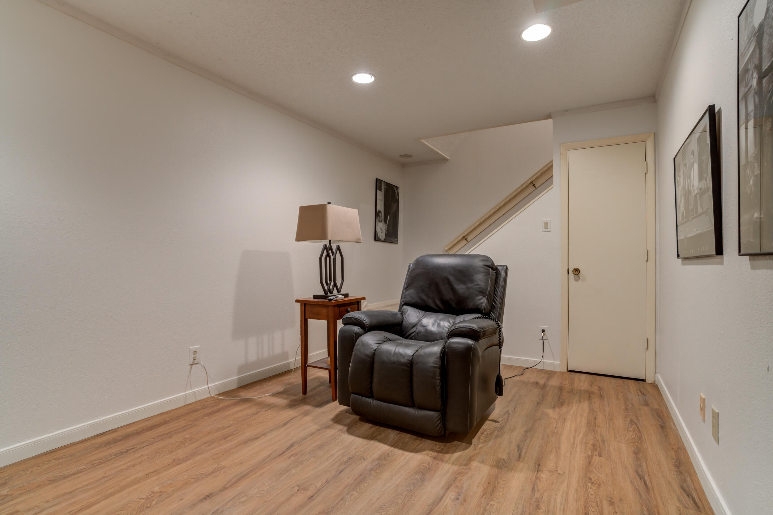 4528 7th Street Lubbock, TX 79416 - Photo 64 of 69 a living room with furniture and a wooden floor