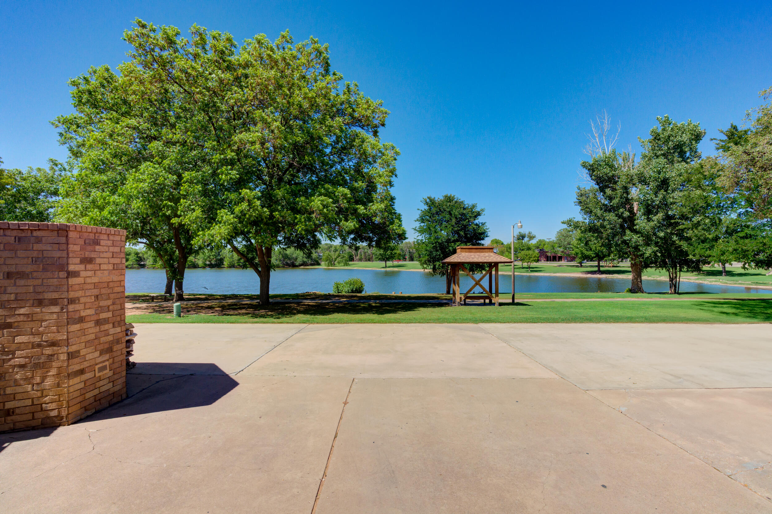 4528 7th Street Lubbock, TX 79416 - Photo 65 of 69 a view of a park with large trees