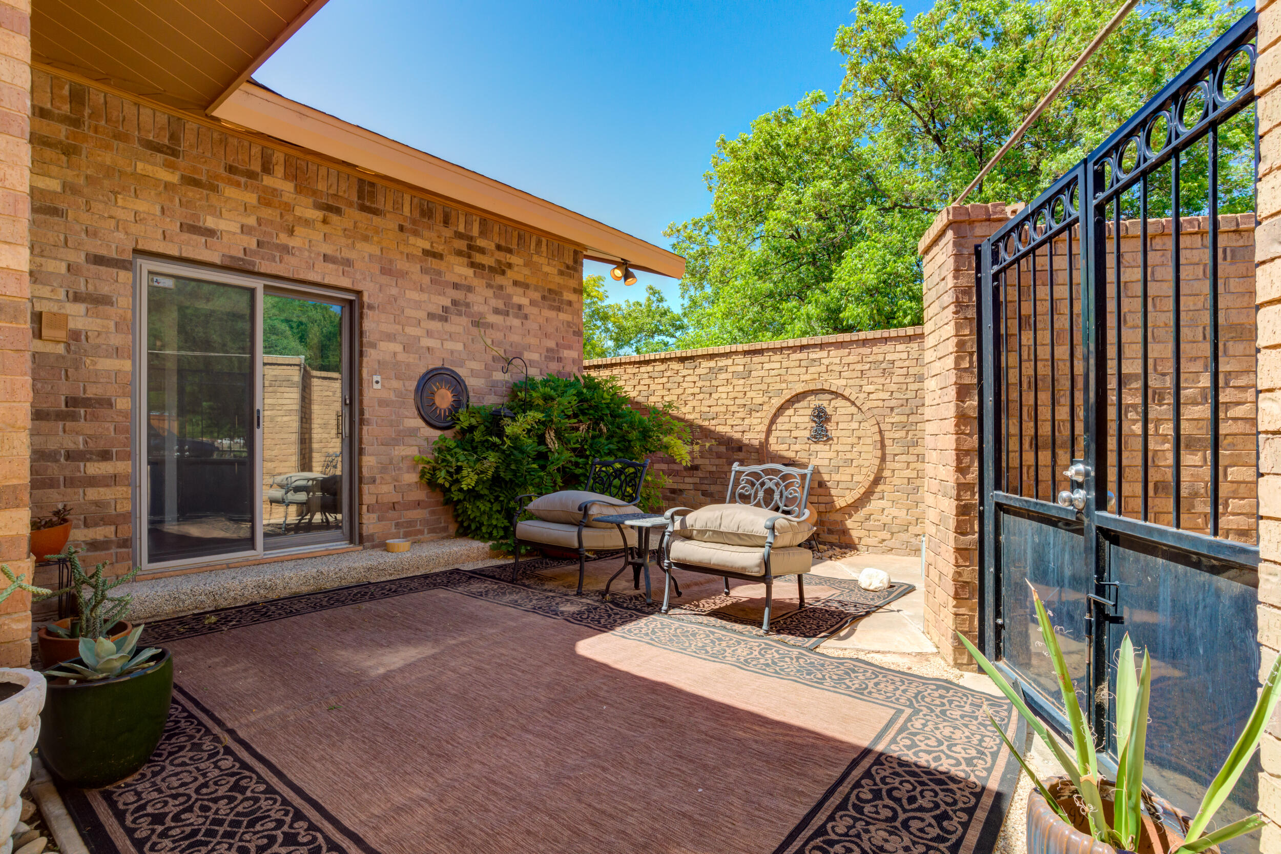 4528 7th Street Lubbock, TX 79416 - Photo 69 of 69 a view of a patio with couple of chairs and a potted plant