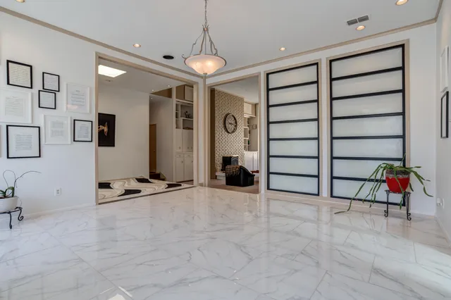 a kitchen with kitchen island granite countertop lots of counter top space and cabinets