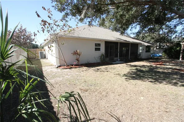 a view of a backyard with patio