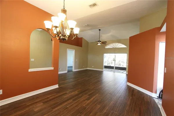 a view of a livingroom with wooden floor