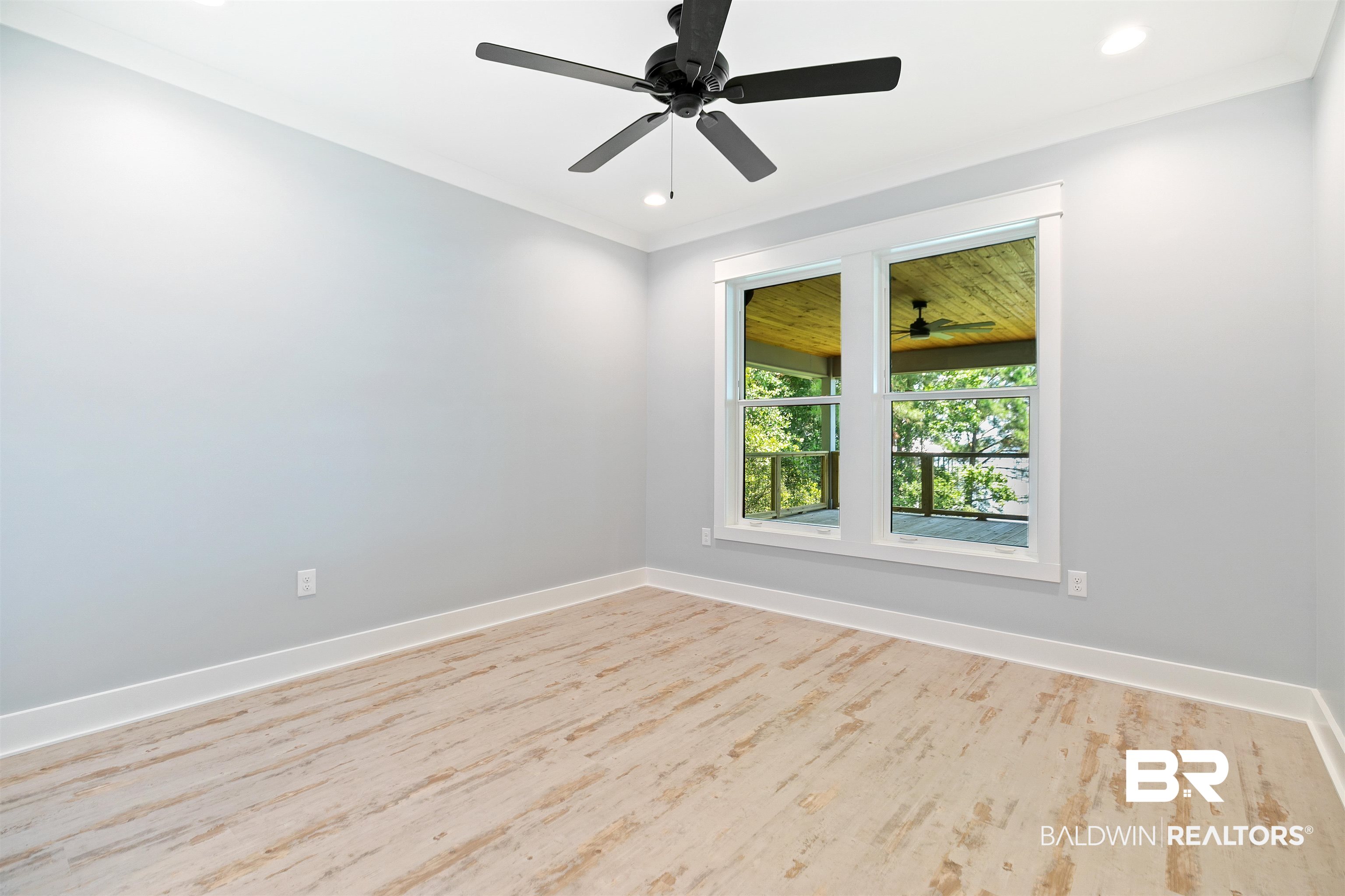 10507 County Road 1 Fairhope, AL 36532 - Photo 19 of 59 Unfurnished room with crown molding, light wood-type flooring, and ceiling fan