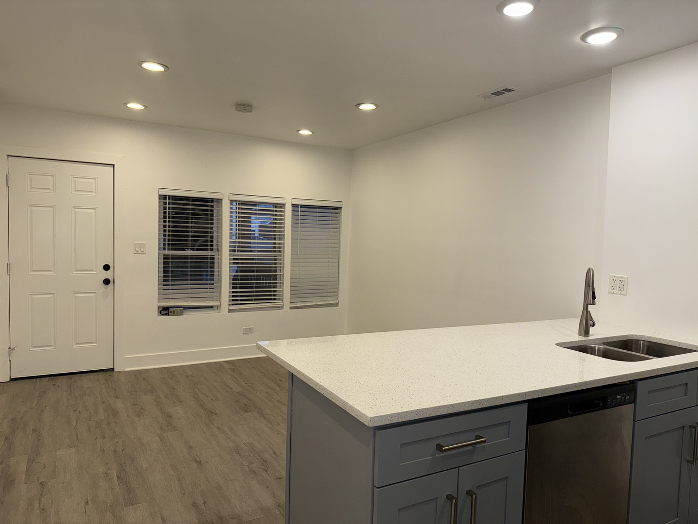 2731 South Homan Avenue, Unit 1 Chicago, IL 60623 - Photo 2 of 10 a kitchen with a sink cabinets and wooden floor