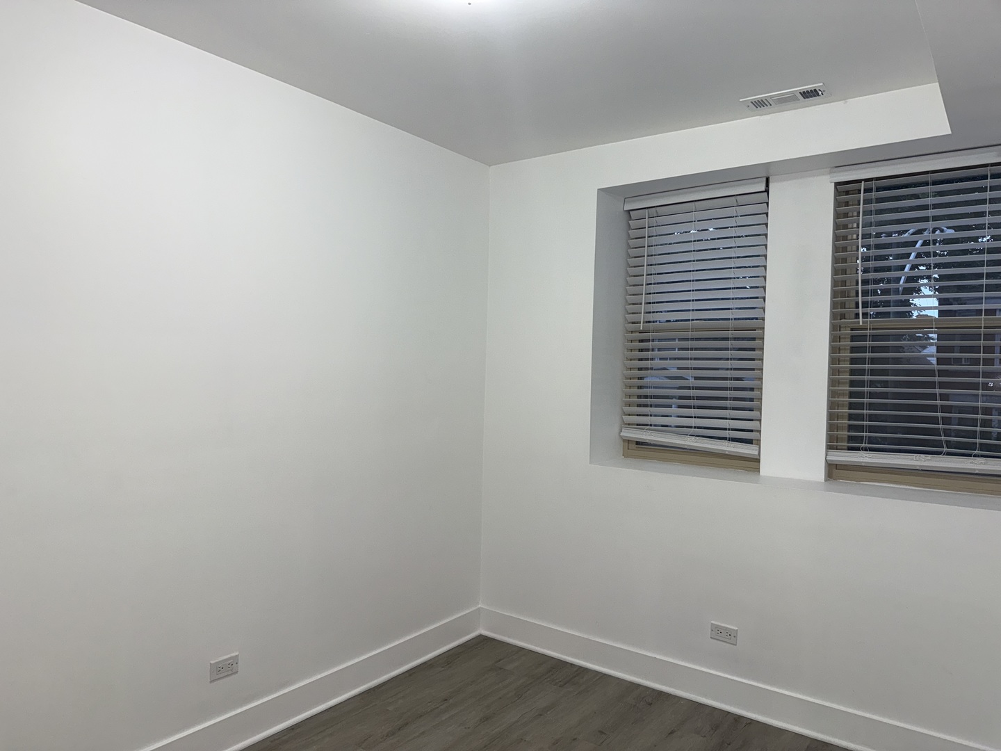 2731 South Homan Avenue, Unit 1 Chicago, IL 60623 - Photo 8 of 10 a view of a small space with wooden floor and a window