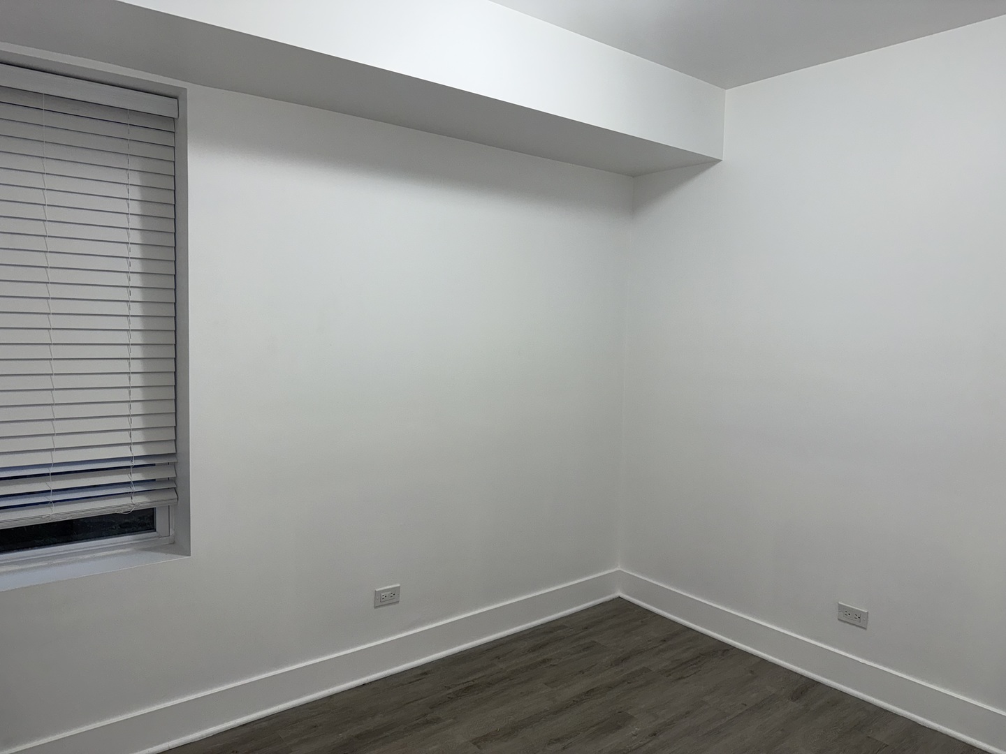 2731 South Homan Avenue, Unit 1 Chicago, IL 60623 - Photo 10 of 10 a view of a small space with wooden floor and a window