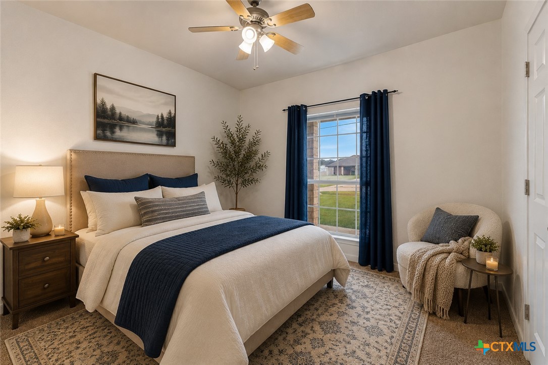 283 County Road 4710 Kempner, TX 76539 - Photo 28 of 47 a bedroom with a bed and a chandelier