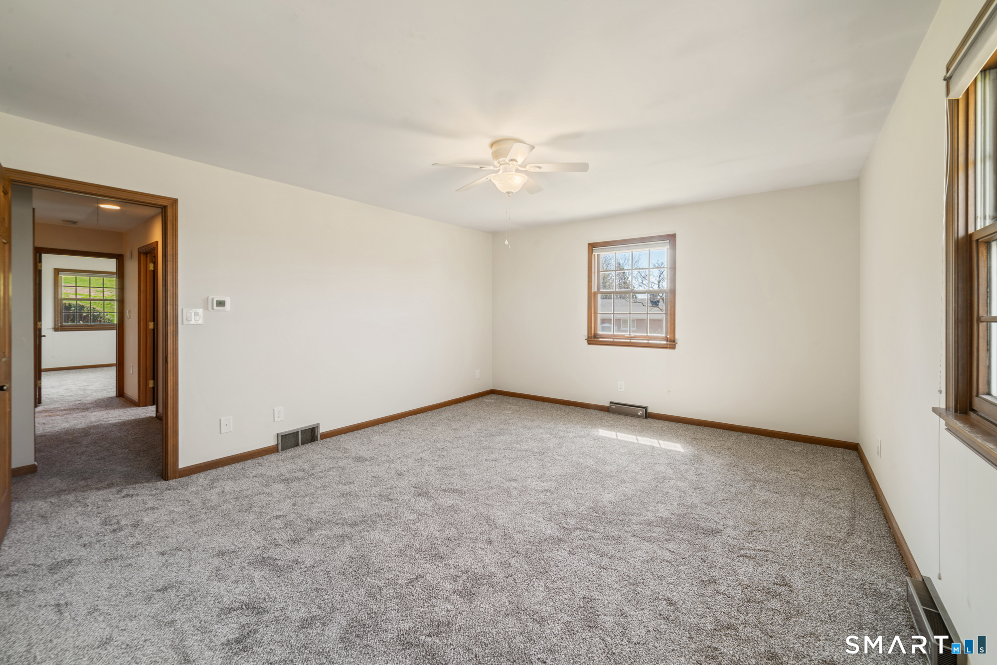 131 Sentinel Hill Road Derby, CT 06418 - Photo 23 of 40 an empty room with windows and ceiling fan