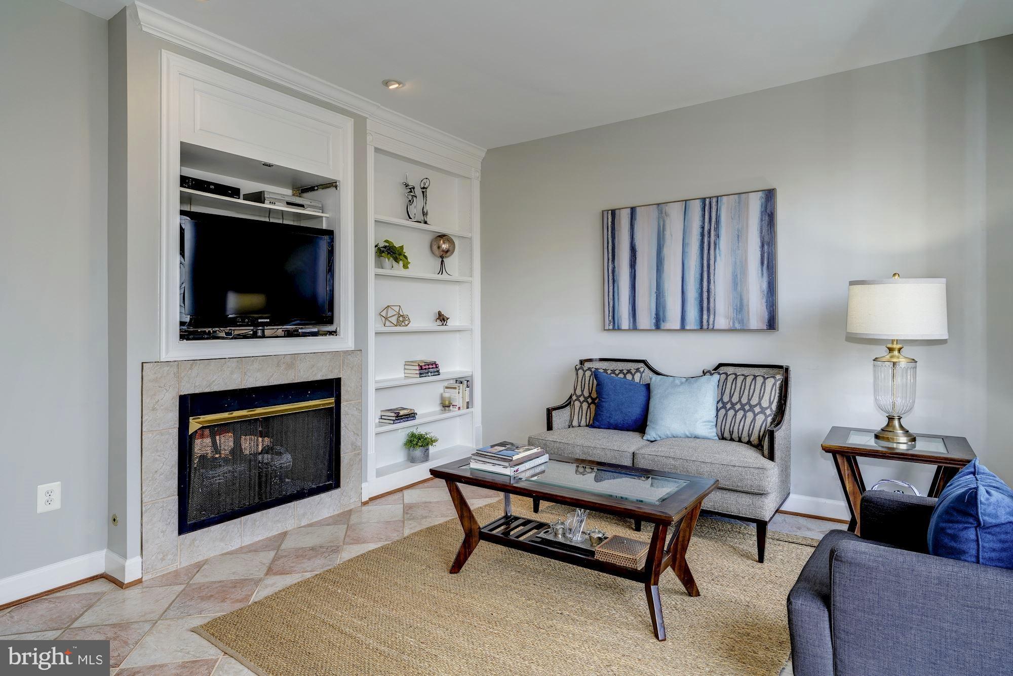 11516 Waterhaven Court Reston, VA 20190 - Photo 17 of 46 Media Wall with 2 Sided Gas Fireplace and Shelving