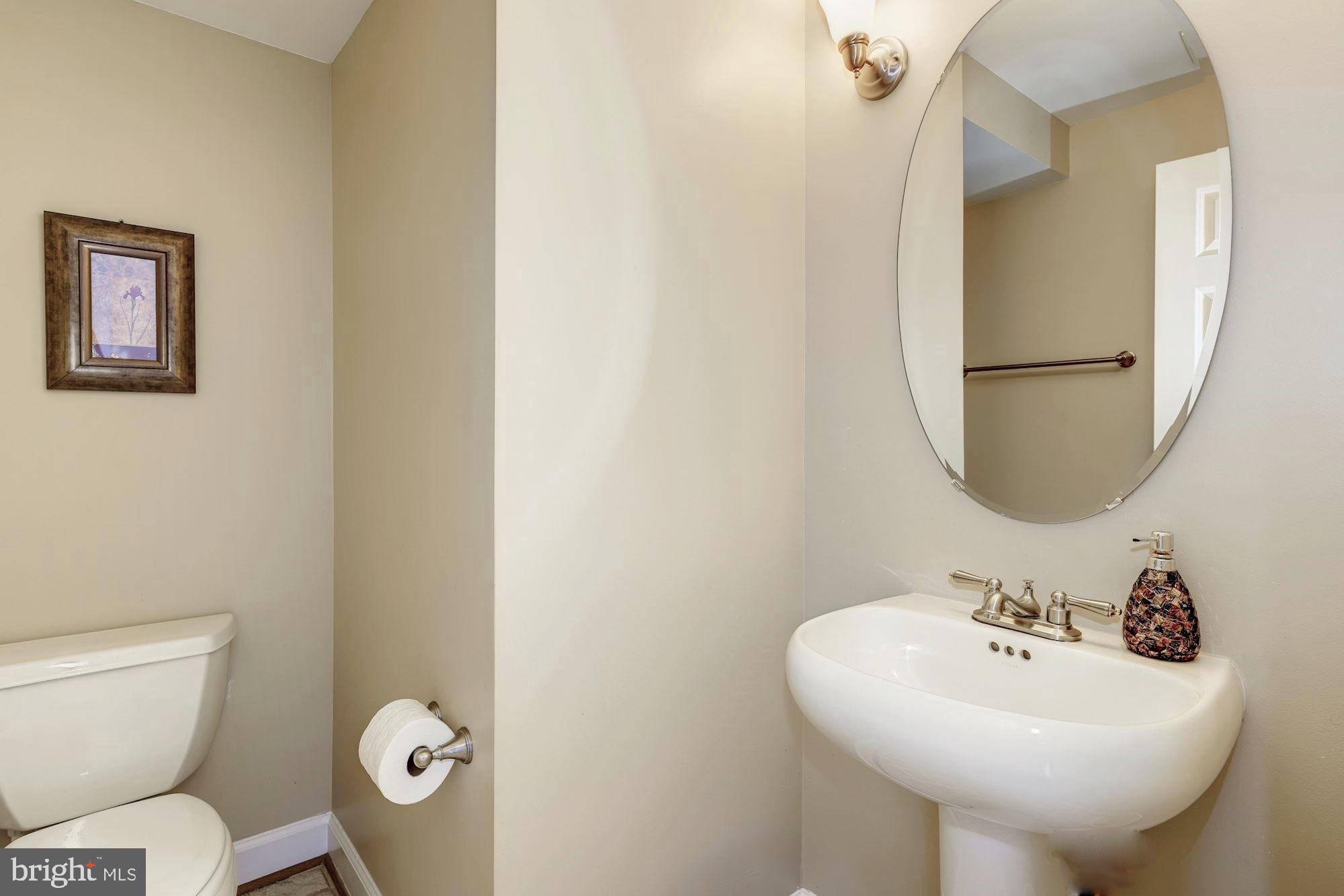 11516 Waterhaven Court Reston, VA 20190 - Photo 18 of 46 Guest Powder Room with Pedestal Sink on Main Level