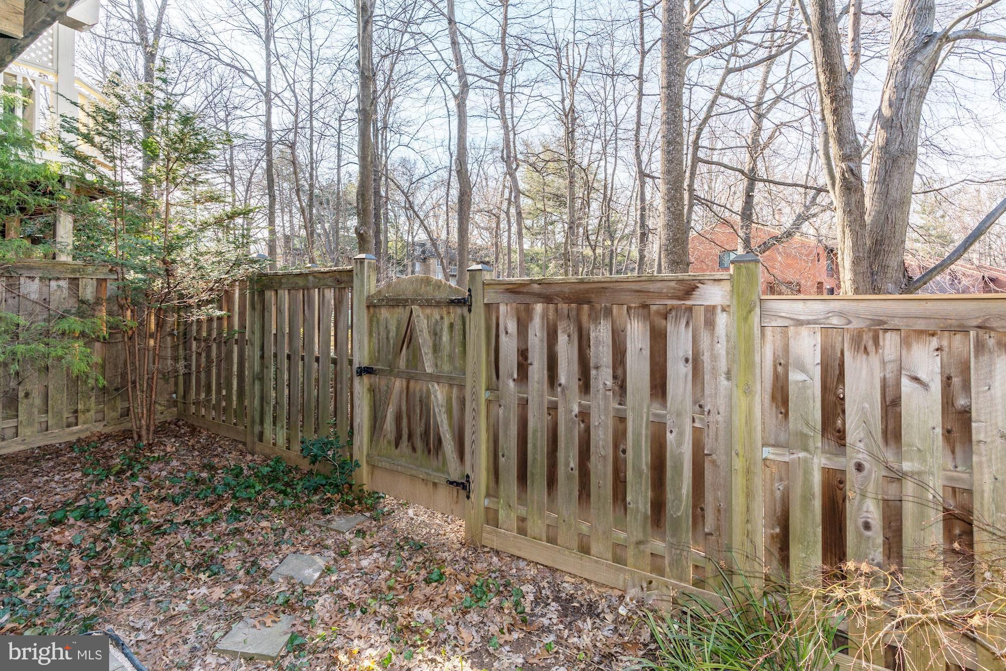11516 Waterhaven Court Reston, VA 20190 - Photo 36 of 46 Fenced Backyard with Gate to Trails to Lake Anne