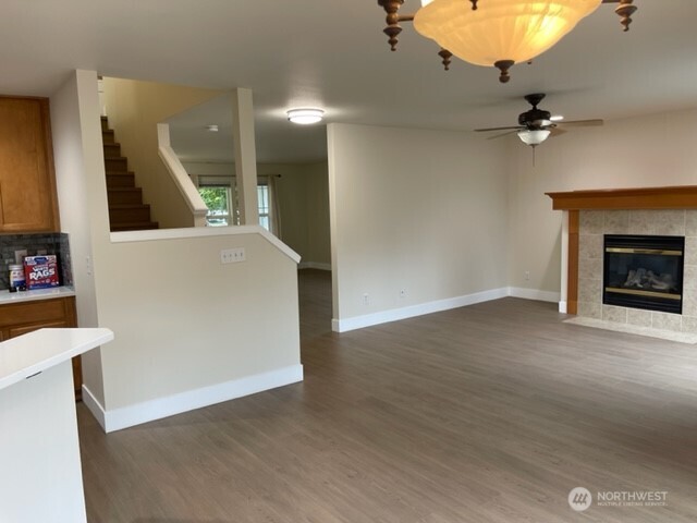 20446 Corbridge Road Southeast Monroe, WA 98272 - Photo 12 of 31 wooden floor in an empty room with a fireplace