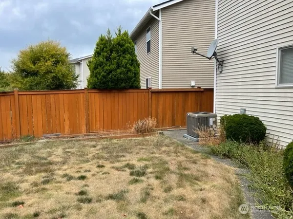 a view of a backyard of the house