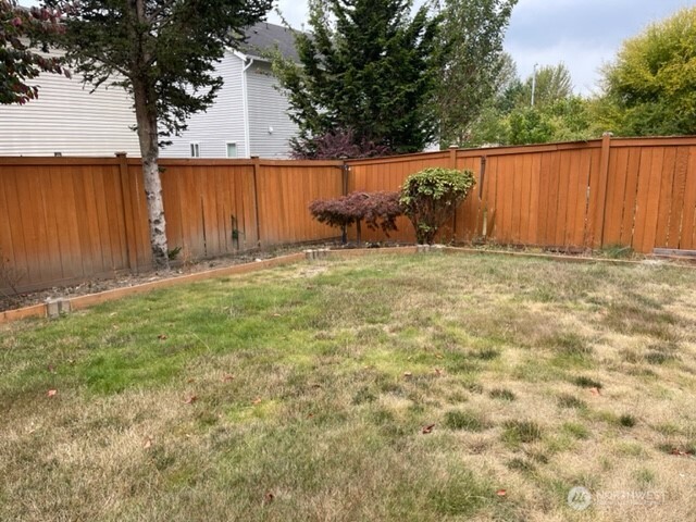 20446 Corbridge Road Southeast Monroe, WA 98272 - Photo 28 of 31 a backyard of a house with lots of green space