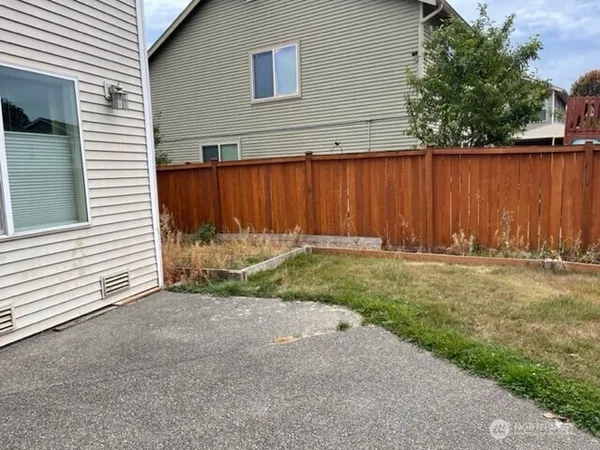 a view of a backyard of a house