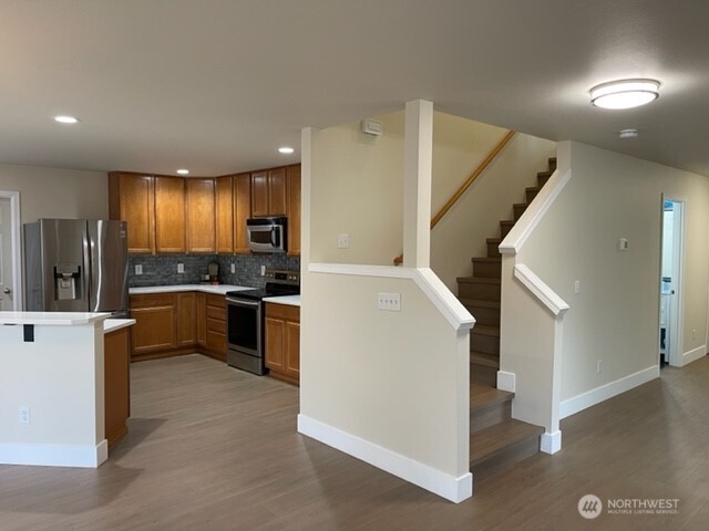 20446 Corbridge Road Southeast Monroe, WA 98272 - Photo 8 of 31 a view of kitchen with cabinets and refrigerator