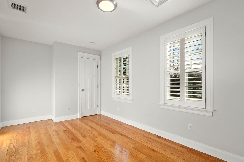 1 Dillingham Avenue Sandwich, MA 02563 - Photo 15 of 36 a view of an empty room with wooden floor and a window