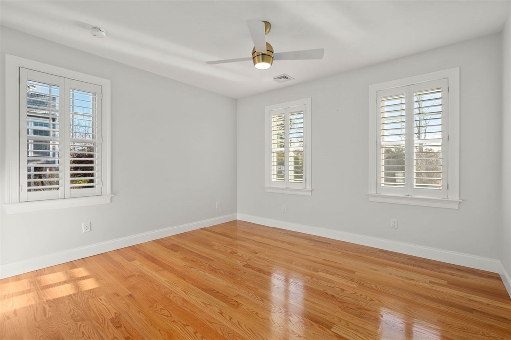 1 Dillingham Avenue Sandwich, MA 02563 - Photo 16 of 36 a view of an empty room with wooden floor and a window